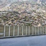 steel retaining wall along hilly terrain